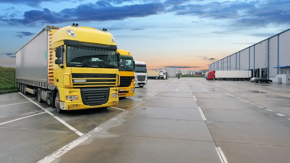warehouse-management-trucks-in-front-of-logistics-center-930x523.jpg